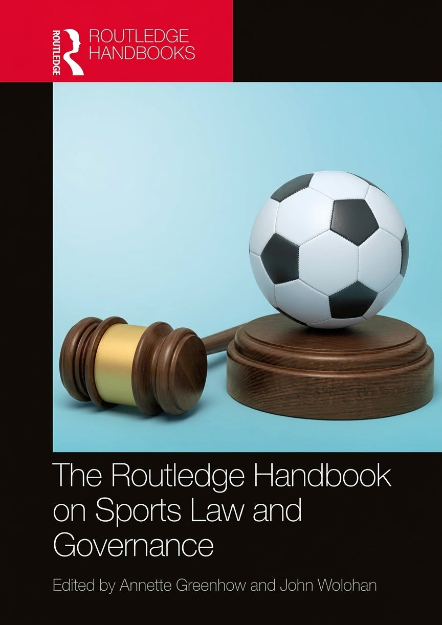 Front cover of the book 'The Routledge Handbook on Sports Law and Governance', edited by Annette Greenhow and John Wolohan. The cover features a red Routledge Handbook banner at the top, a central graphic of a soccer ball resting on a wooden gavel and stand against a light blue background, and black lower sections with white title text.